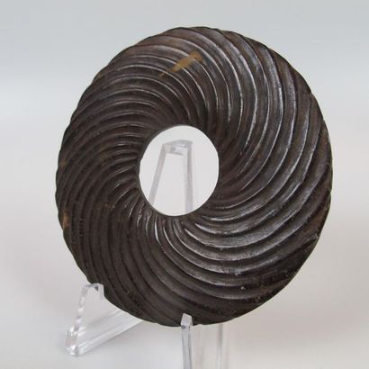 Bi disc with spiral decoration. Brown nephrite...