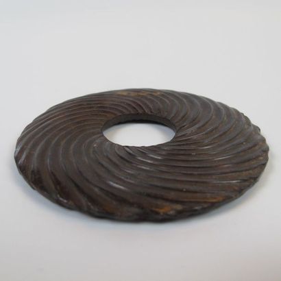 Bi disc with spiral decoration. Brown nephrite...