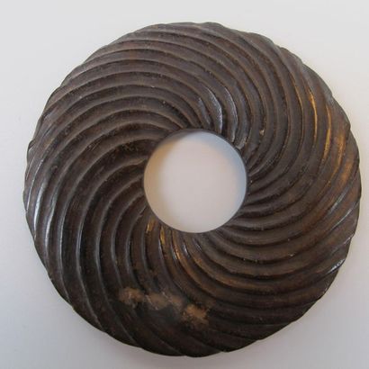 Bi disc with spiral decoration. Brown nephrite...