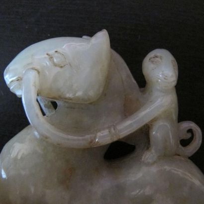 Riding monkey. Celadon nephrite jade. Traditional...