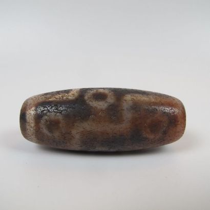 Nine-eyed Dzi pearl, protective talisman....