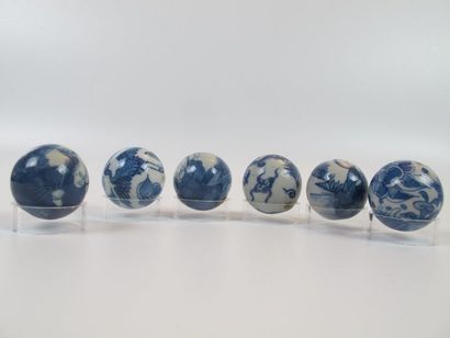 Six white-blue enameled porcelain beads....