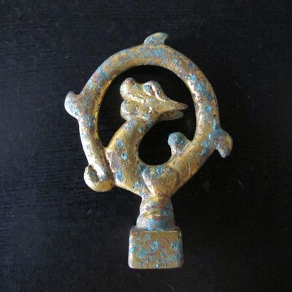 Small square stamp, the catch formed by a...