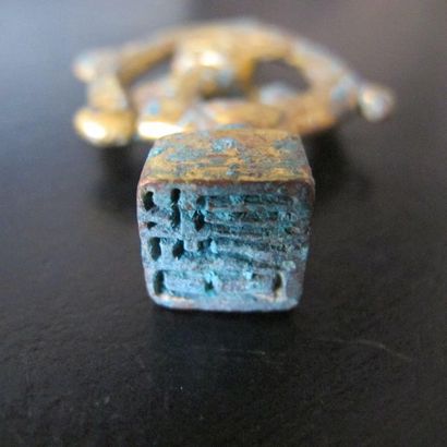 Small square stamp, the catch formed by a...