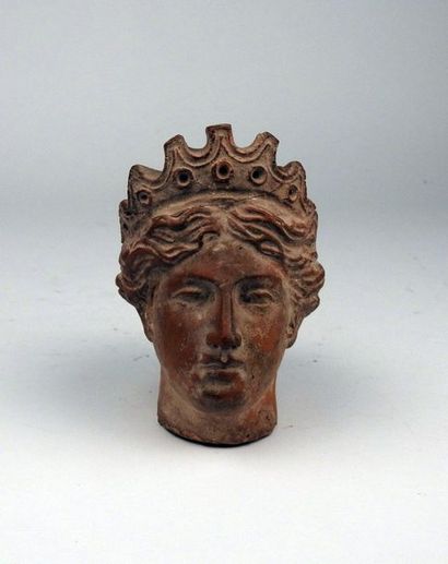 Head of Tyche wearing the tiara

Terracotta...