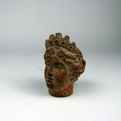 Head of Tyche wearing the tiara

Terracotta...