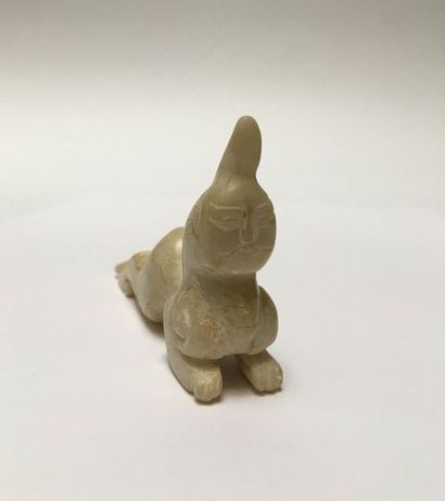 Mythical animal in beige jade. Body of a...