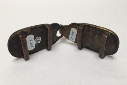 Bronze belt buckle decorated with monograms...