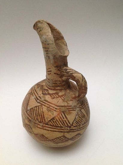 Beige terracotta ovoid jug decorated with...