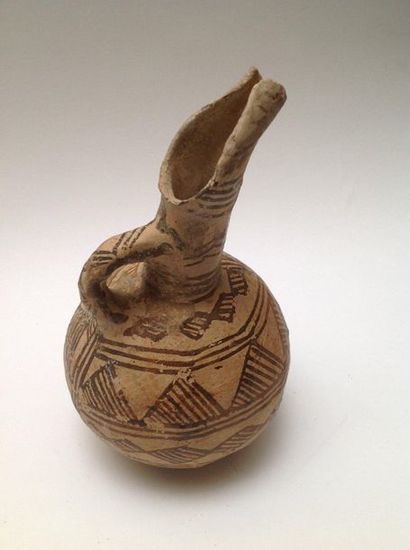 Beige terracotta ovoid jug decorated with...
