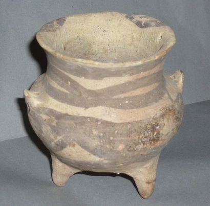 Beige terracotta tripod vase decorated with...