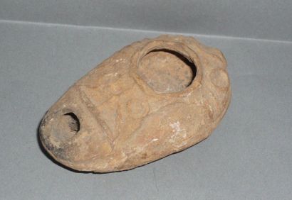 Beige terracotta oil lamp decorated with...