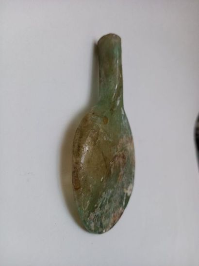 Flat-bellied bottle in well iridescent glass...