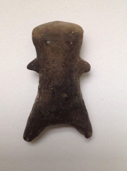 Pink terracotta figurine representing a stylized...