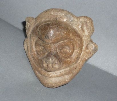 Pink terracotta figurine representing a stylized...