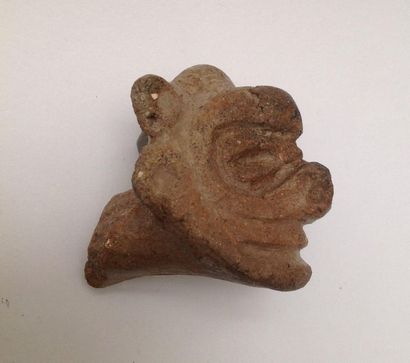 Pink terracotta figurine representing a stylized...