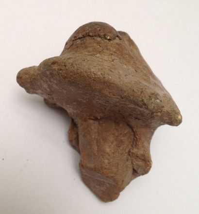 Pink terracotta figurine representing a stylized...