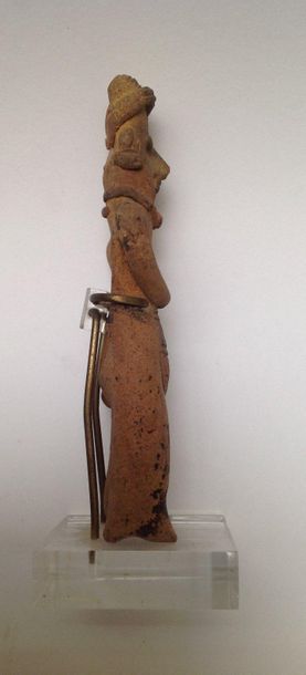 Standing character, he wears a braided loincloth,...