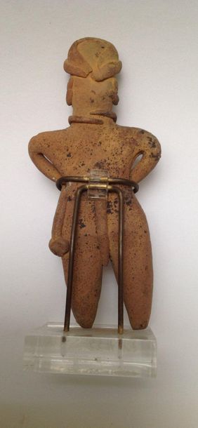 Standing character, he wears a braided loincloth,...