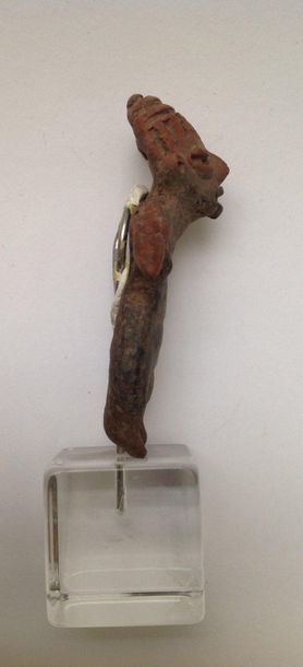 Female figurine standing with her arms spread...