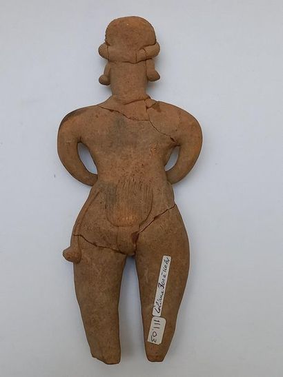 Standing figure wearing a braided loincloth...