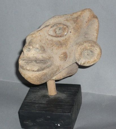 Beige terracotta fragmentary head probably...