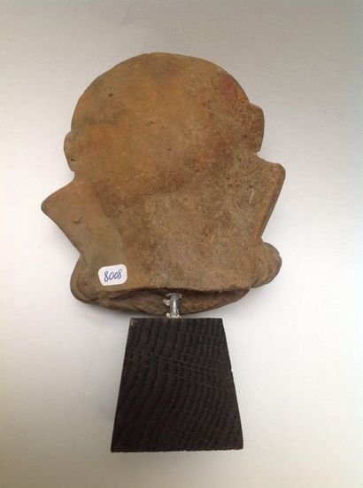 Large smiling head in beige terracotta. His...