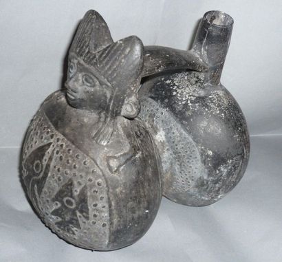 Double-bellied black ceramic stirrup vase....