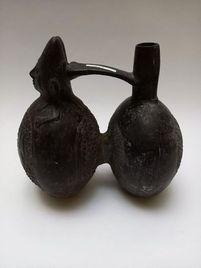 Double-bellied black ceramic stirrup vase....