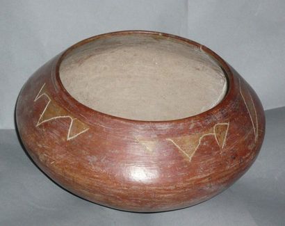 Lenticular terracotta vase painted red ochre....