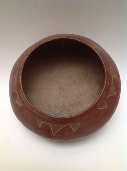 Lenticular terracotta vase painted red ochre....