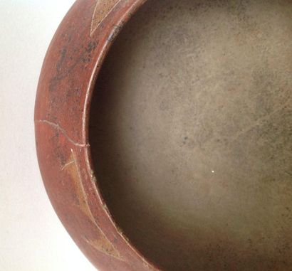 Lenticular terracotta vase painted red ochre....