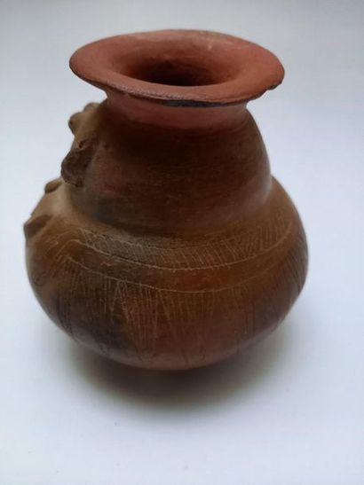 Vase representing a dignitary with stylised...