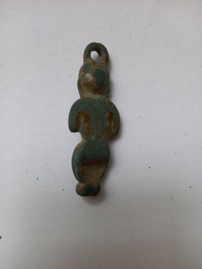 Bronze pendant amulet with green patina representing...