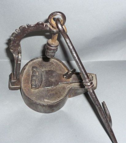 Iron oil lamp and its hanger. Probably medieval....