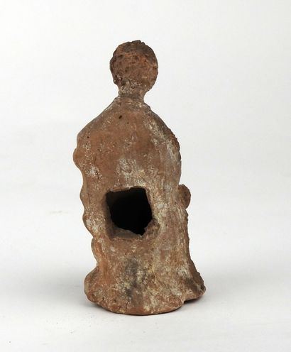 Statuette representing a seated figure, leg...