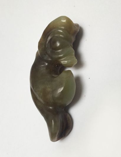 Small coiled dragon in green nephrite, veined...