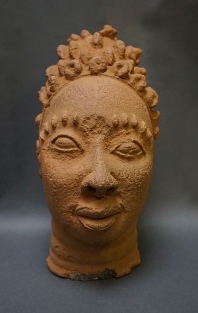Head made of low-baked clay, with scarified...