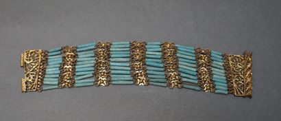 Bracelet manchette souple en métal doré composé...