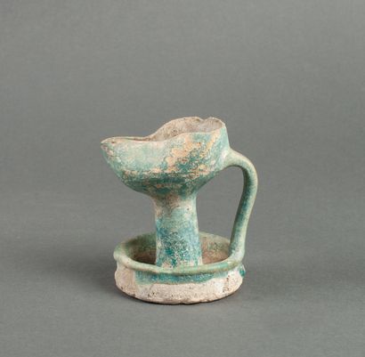 Oil lamp on a green glazed ceramic pedestal...