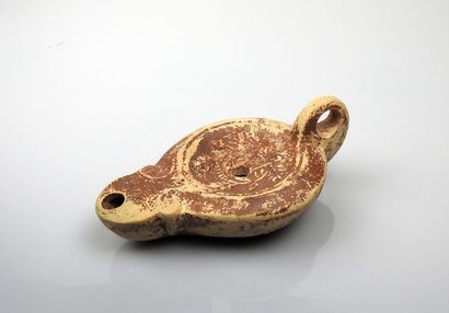 Oil lamp with ogival spout and simple scrolls...
