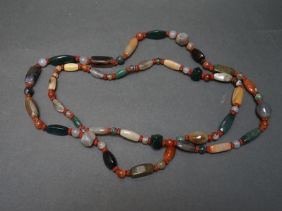 Long necklace made of beads of various shapes...