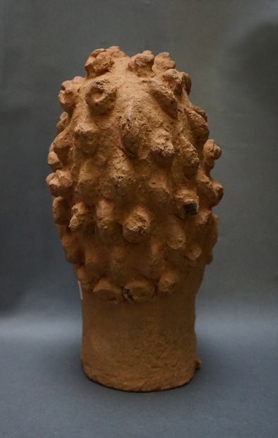 Head made of low-baked clay, with scarified...