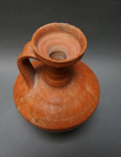 Jug with handle and flared neck in orange...