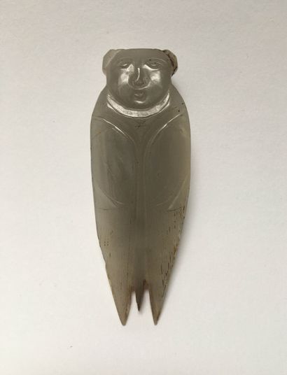Cicada with a cherub's head in grey jade....