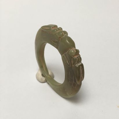 Pale green jade pendant ring in the form...