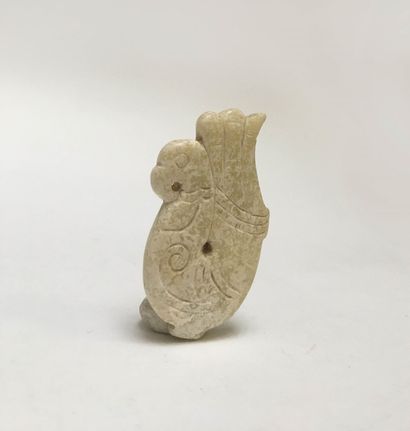 A fish-brain jade pendant representing a...