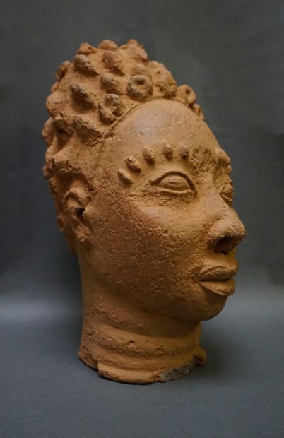 Head made of low-baked clay, with scarified...