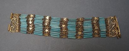 Bracelet manchette souple en métal doré composé...