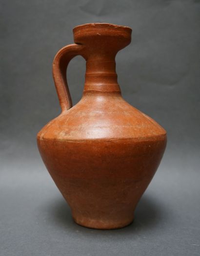 Jug with handle and flared neck in orange...